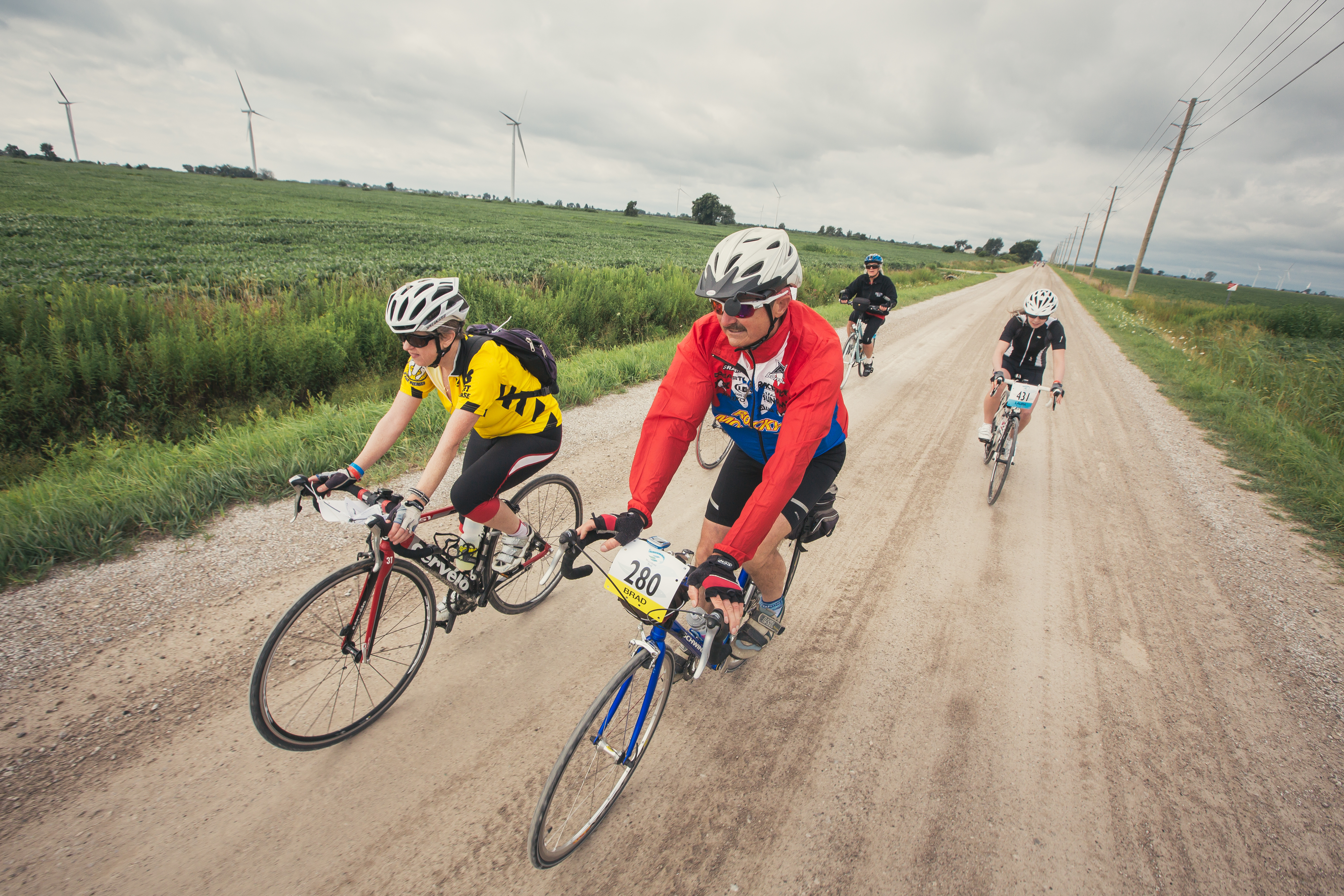 cyclists on dirt road 